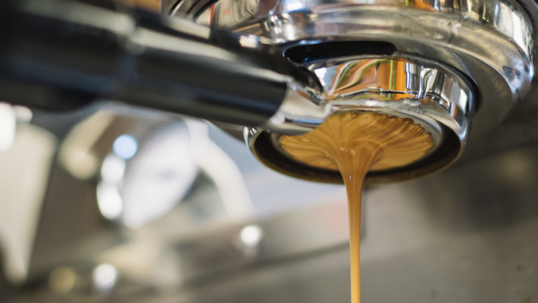close-up of coffee pouring from portafilter